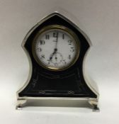 An Edwardian silver and tortoiseshell clock with w