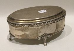 A Dutch silver oval ring box with hinged top on re