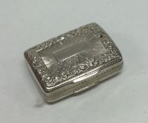 An attractive chased George III silver vinaigrette