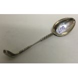A heavy silver teaspoon in the form of a golf club