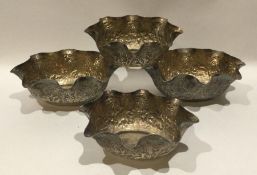 A set of four Indian silver shaped dishes of bambo