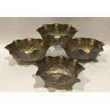 A set of four Indian silver shaped dishes of bambo