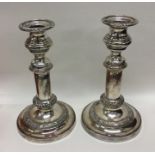 A pair of silver plated telescopic candlesticks of