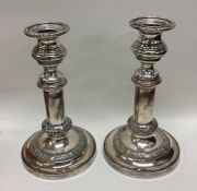 A pair of silver plated telescopic candlesticks of