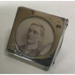 A small silver mounted picture frame with leathere