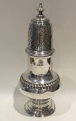 A heavy Edwardian silver baluster shaped caster. L