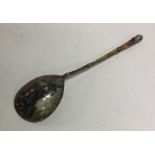 A Russian silver and enamelled spoon decorated wit