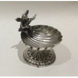 A small Continental silver shell shaped dish with