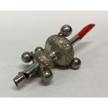 A Chinese silver rattle / coral teether. Circa 189