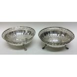 A pair of pierced silver bonbon dishes with panell