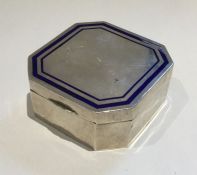 A silver and blue enamelled box with cut corners.