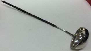 A Georgian silver and whalebone toddy ladle. Appro