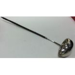 A Georgian silver and whalebone toddy ladle. Appro
