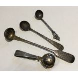 A pair of heavy silver sugar tongs together with a