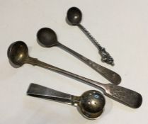 A pair of heavy silver sugar tongs together with a