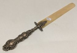 An Edwardian silver and ivory mounted paper knife.