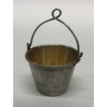 A Russian silver engraved silver tea strainer with