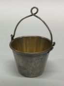 A Russian silver engraved silver tea strainer with