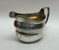 A good quality George III engraved silver cream ju