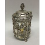 A heavy Continental silver mustard pot decorated w