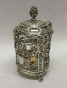 A heavy Continental silver mustard pot decorated w
