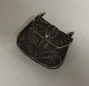 A Continental silver model of a bag with hinged to