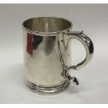 A heavy George II tapering silver mug on sweeping