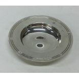 A circular silver armada dish of typical form. Lon