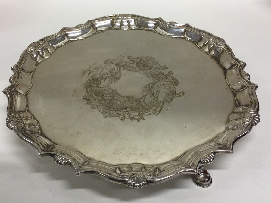 A Georgian silver circular salver attractively dec