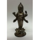 An unusual silver model of a Tibetan figure in sta