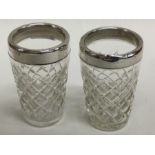 A pair of silver mounted and glass tapering beaker