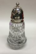 A glass and silver mounted sugar caster. London. E