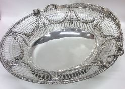 A good crisp Georgian silver swing handled sugar b