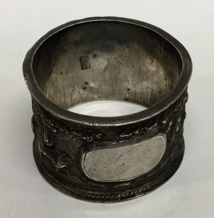 A Chinese silver napkin ring decorated with figure - Image 2 of 3