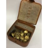 A leather jewellery box containing Military button