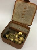 A leather jewellery box containing Military button