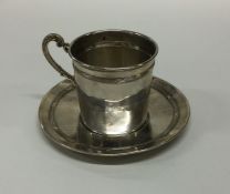 A French silver drinking cup together with matchin