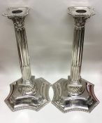 A good pair of large cast silver candlesticks with