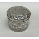 A heavy silver and cut glass dressing table jar de