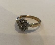 A circular diamond cluster ring in 9 carat mount.