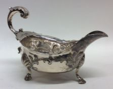 A good Georgian silver sauce boat chased with flow