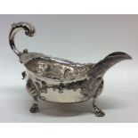 A good Georgian silver sauce boat chased with flow