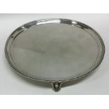 A good George III circular silver waiter with bead