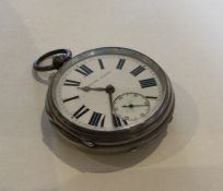 A silver open faced pocket watch with white enamel