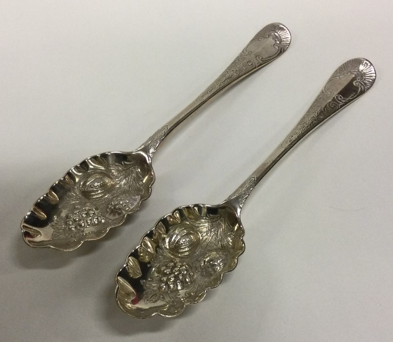 A good pair of early Georgian silver berry spoons