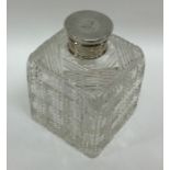 A silver and cut glass mounted scent bottle of squ