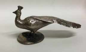 A novelty silver model of a peacock in standing po