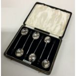 A boxed set of six silver bean top coffee spoons.