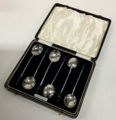 A boxed set of six silver bean top coffee spoons.