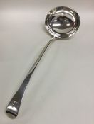 A George III crested silver soup ladle. London 180